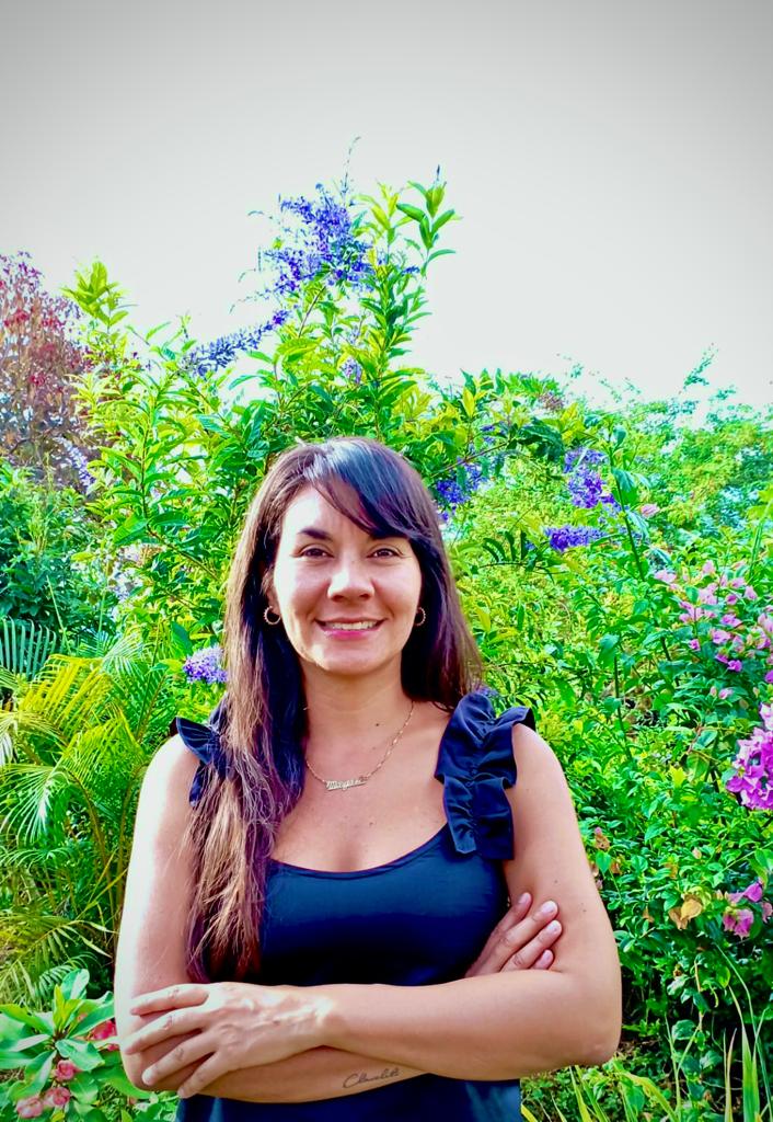 Photo of Margaritas in front of floral foliage.